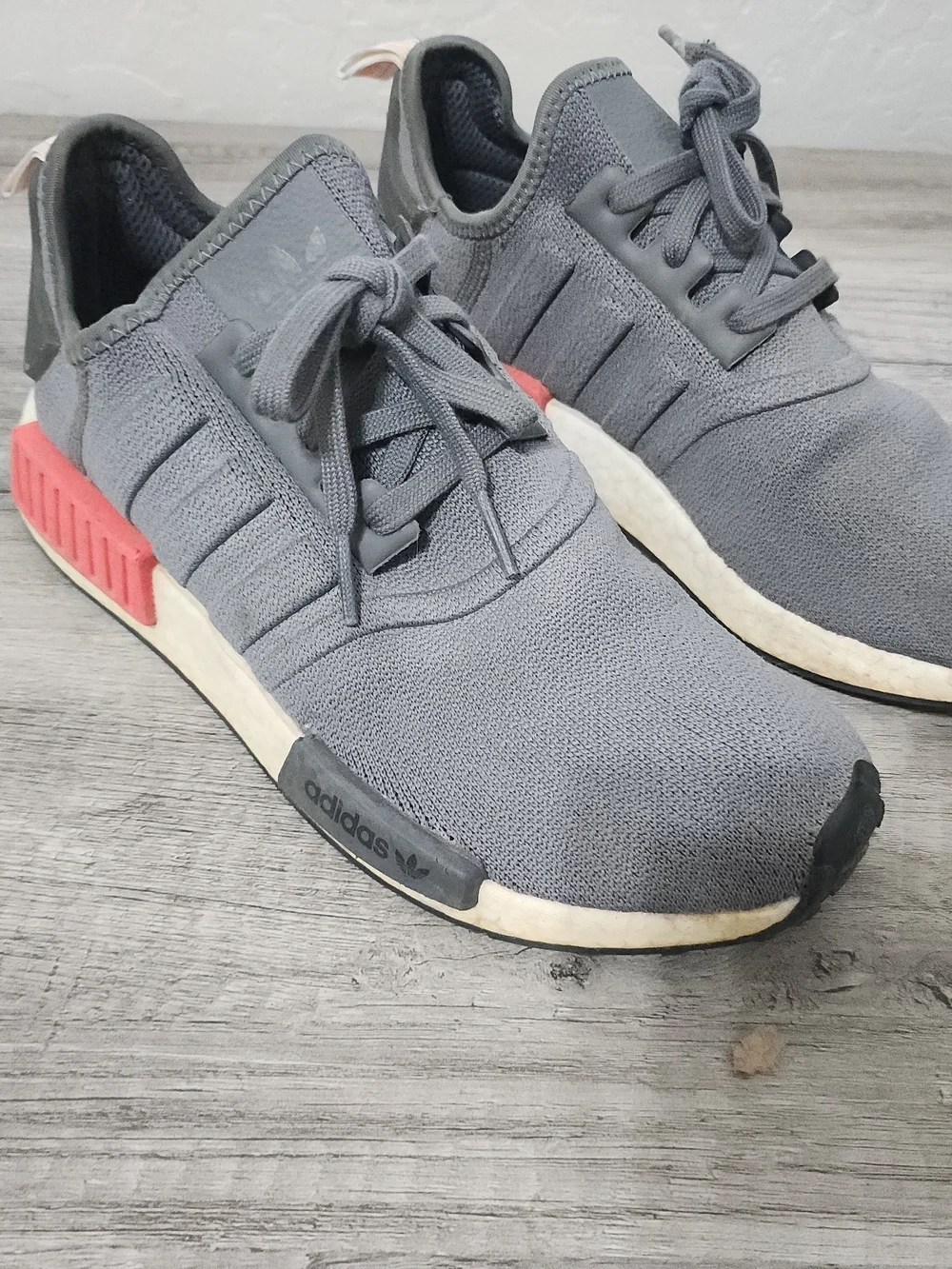 adidas Men’s Gray NMD_R1 Casual Sneaker with Red Accents